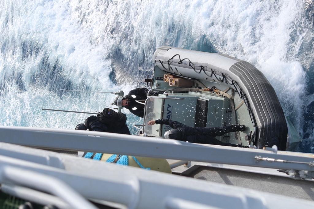 TE KAHA Liaison Officer Medic and Engineer embark on sea boat © New Zealand Defence Force